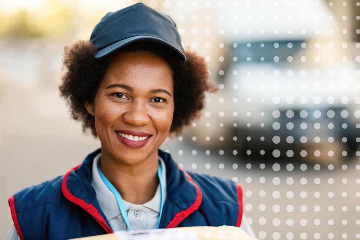 A middle-aged African-American woman wearing a logistics uniform representing and internal communications manager working with CommsKit