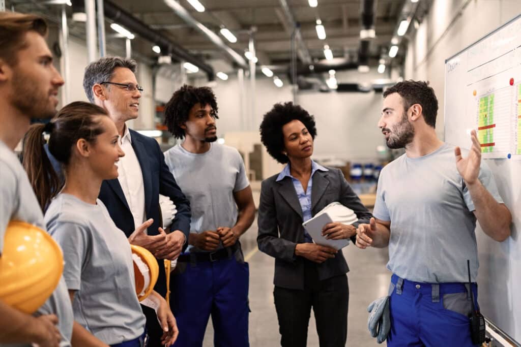 group of frontline workers attending an employee onboarding workshop with CommsKit