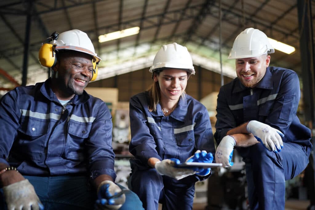 Frontline workers on site, representing sustainability communications reaching a mixed-access workforce